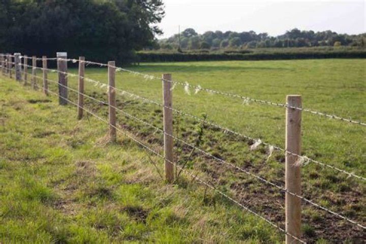 barbed wire fence cost per acre