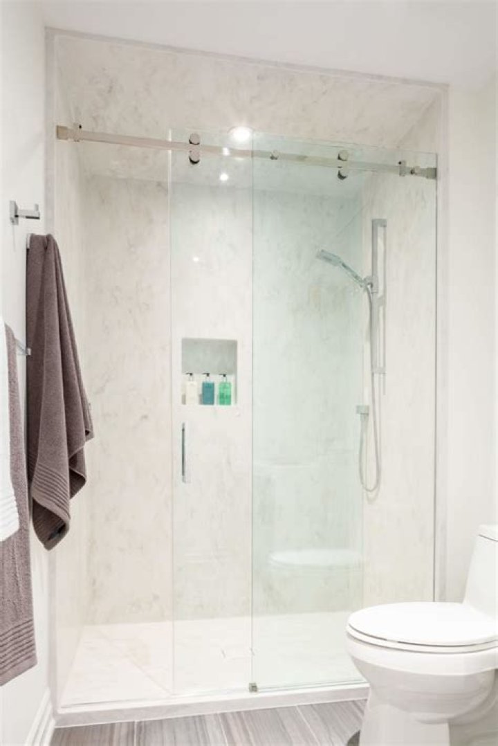 cost of corian shower walls