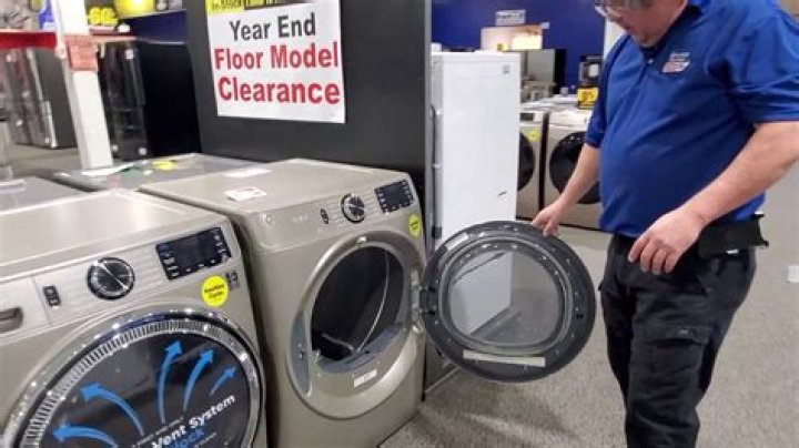 front load washer with reversible door hinge