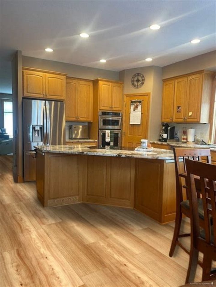 golden oak honey oak cabinets with dark wood floors