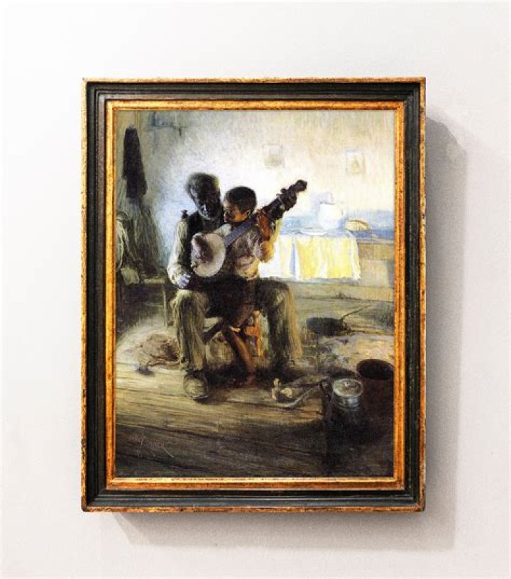 henry ossawa tanner’s the banjo lesson creates emphasis through