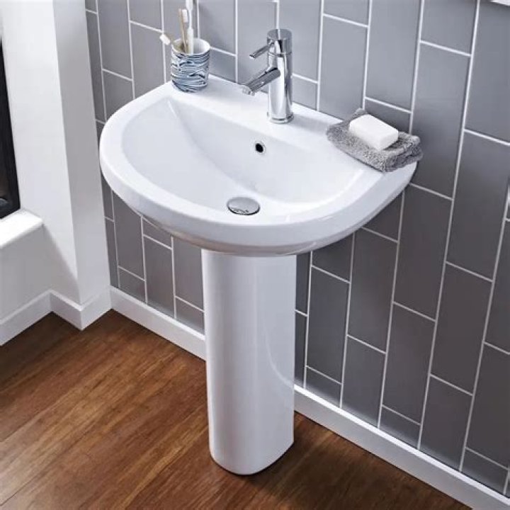 pedestal sink plumbing hide