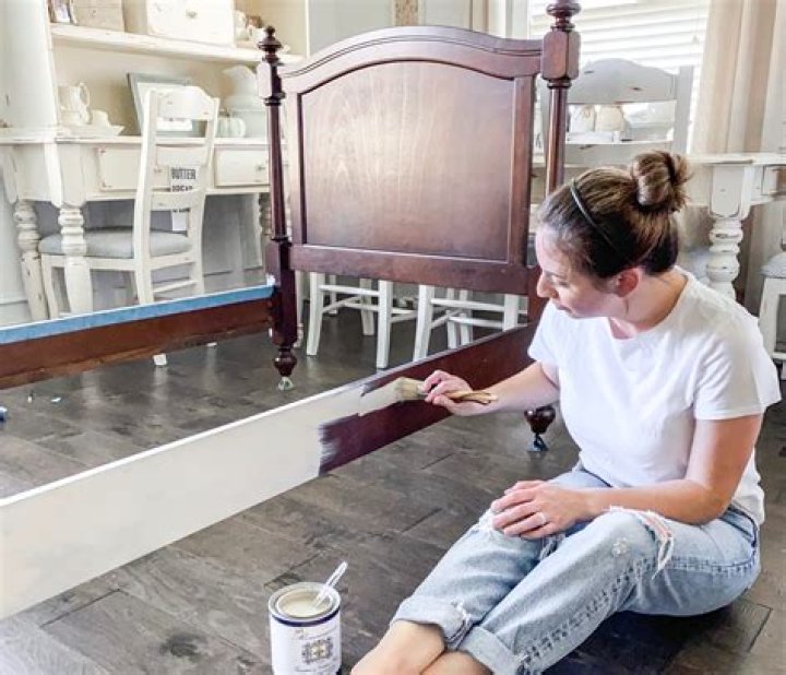 spray painting a wooden bed frame