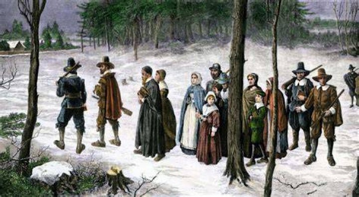 what kind of government did the puritans in massachusetts bay create?