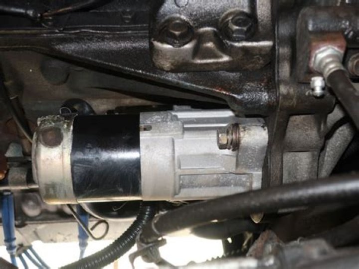 where is the starter located on a 2001 chevy impala
