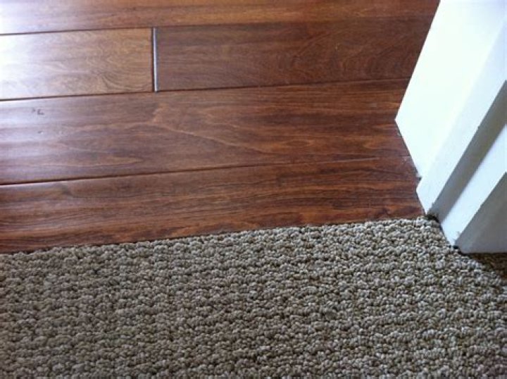 where to transition flooring in doorway
